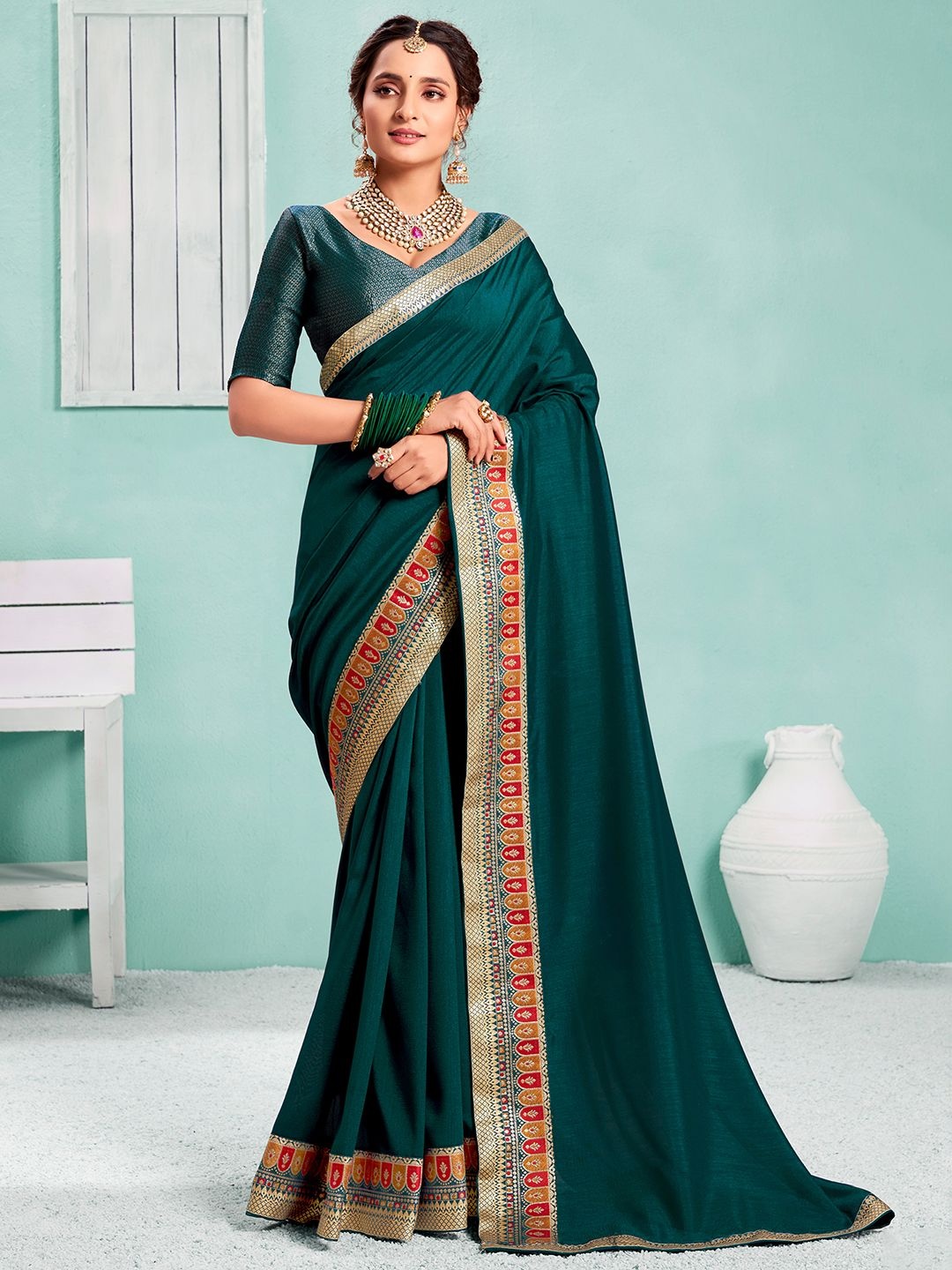 

KALINI Woven Design Zari Solid Saree With Matching Blouse, Teal