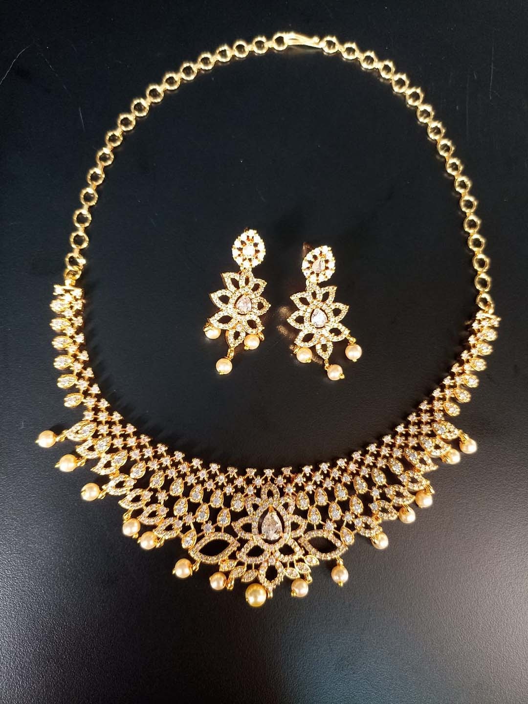 

CARDINAL Gold-Plated American Diamond Studded & Beaded Jewellery Set