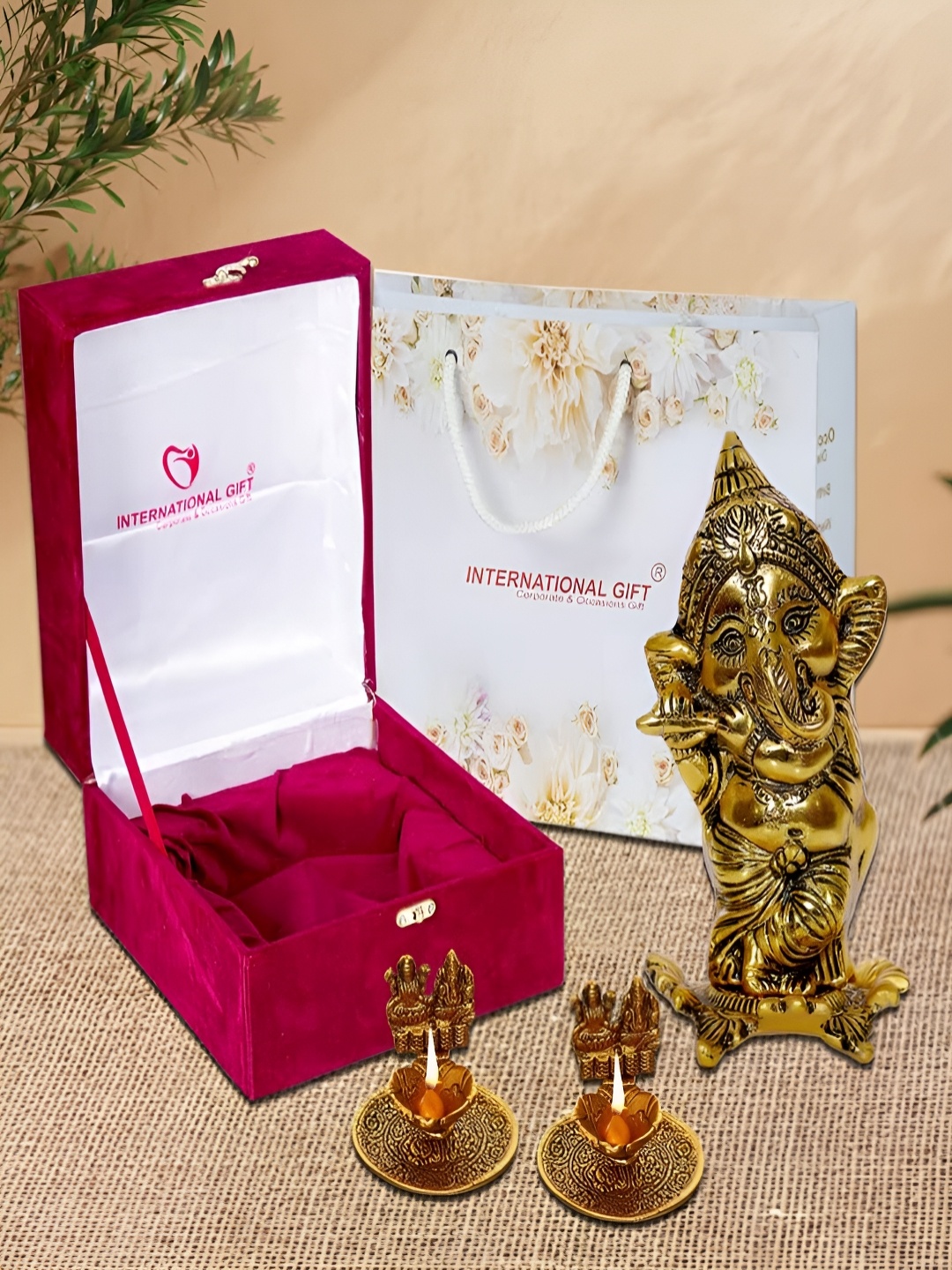 

INTERNATIONAL GIFT Gold-Toned 4 Pieces Religious Idol Showpiece With Diyas & Box