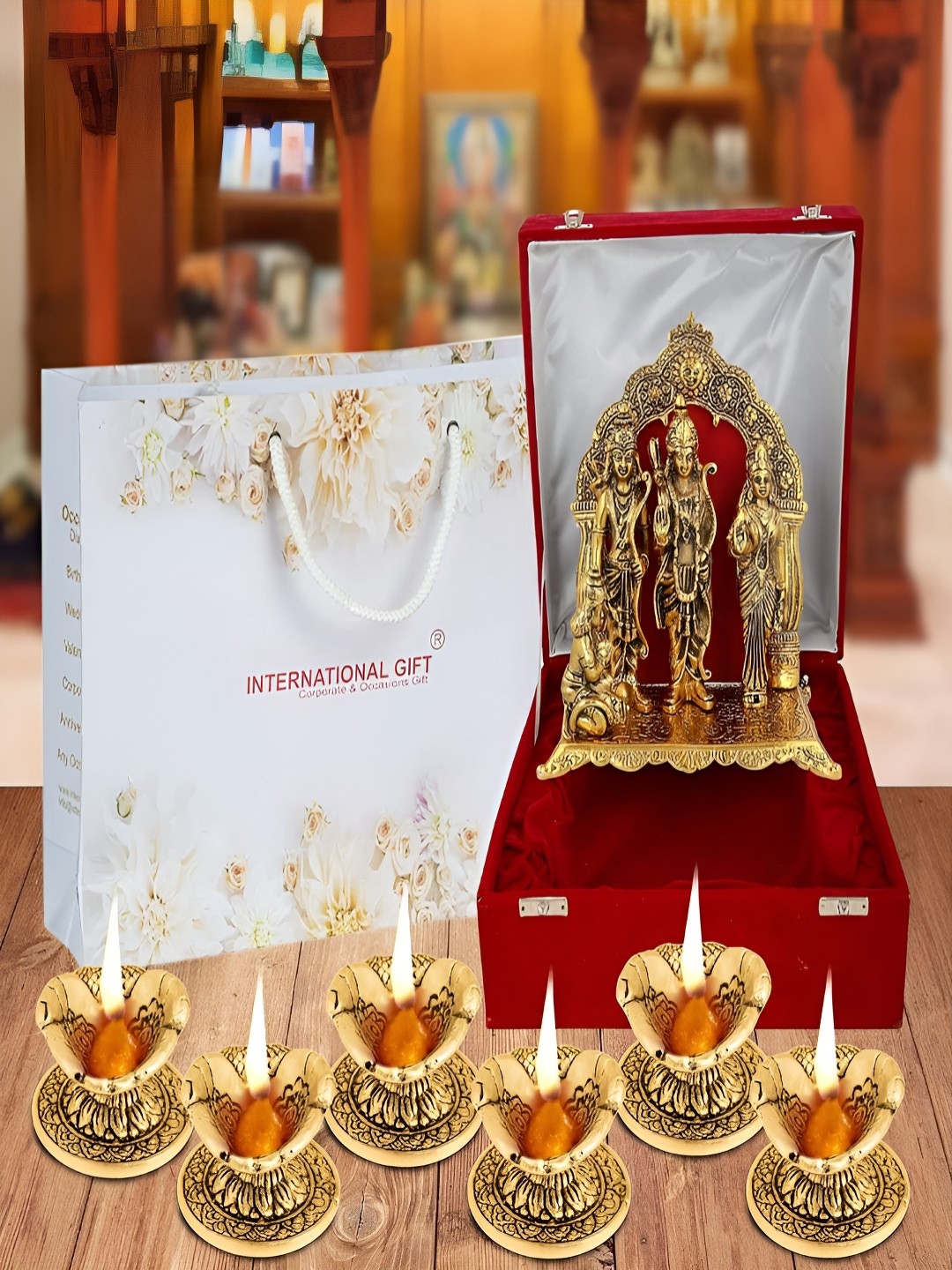 

INTERNATIONAL GIFT Gold-Toned Religious Figurine Showpiece With Diyas & Velvet Box