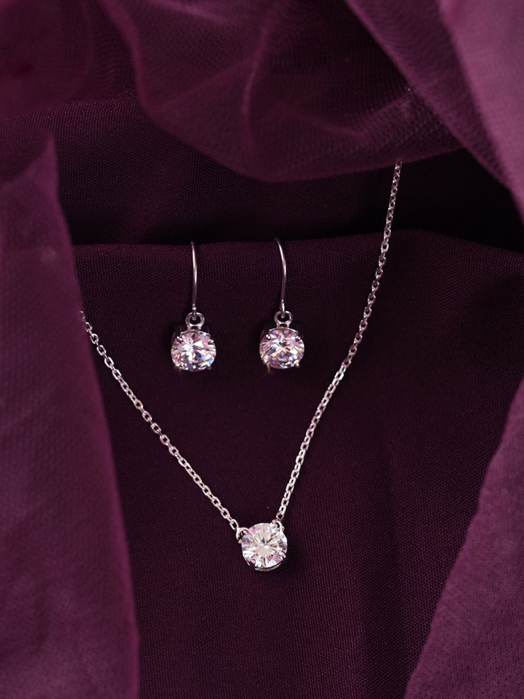 

Clara 925 Sterling Silver Rhodium Plated CZ Studded Pendant & Earrings