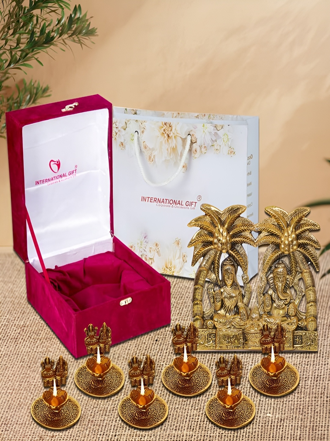 

INTERNATIONAL GIFT Gold-Toned 8 Pieces Religious Idol Showpiece With Diyas & Box