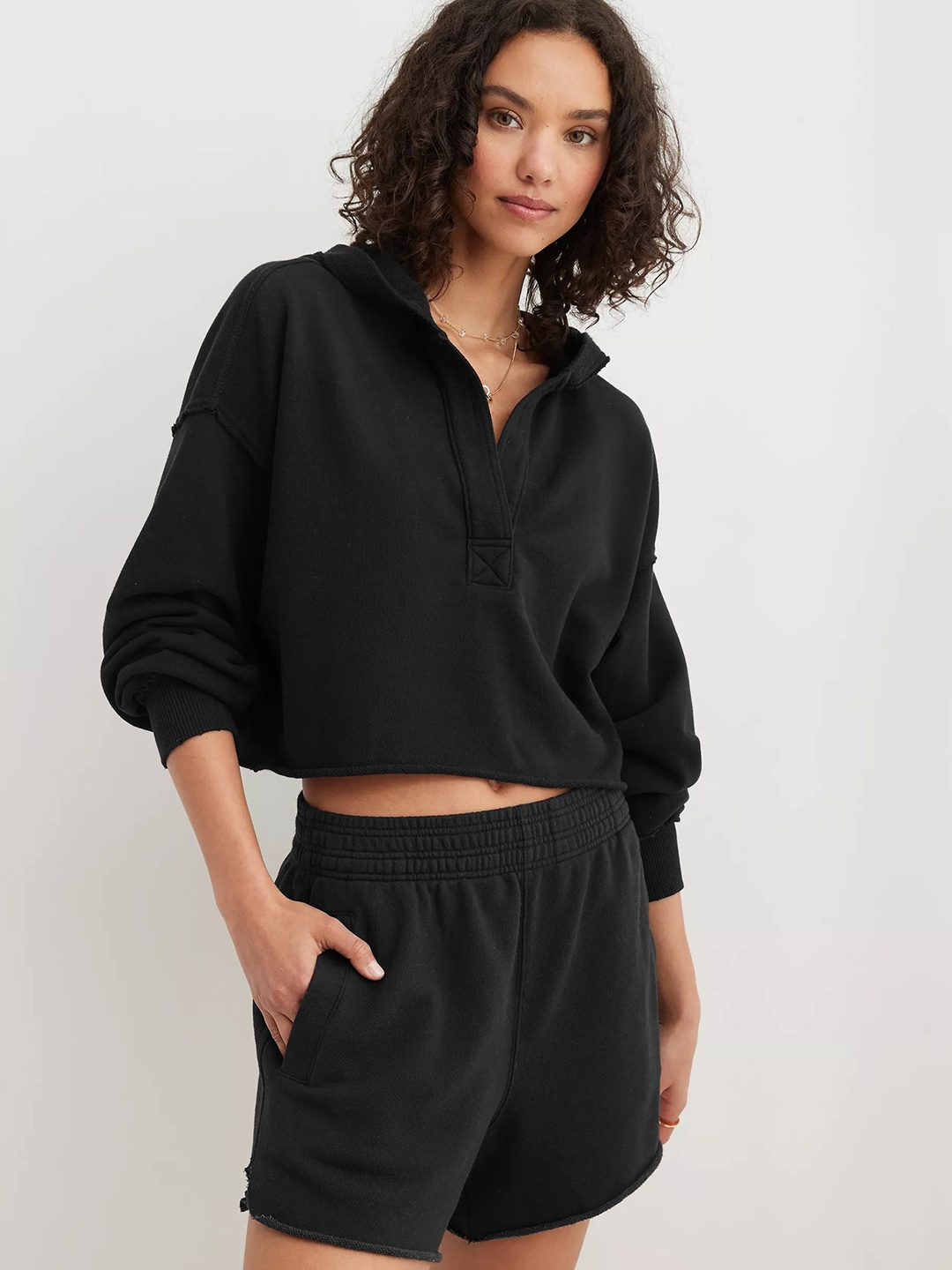 

StyleCast x Revolte Women Solid Hooded Crop Sweatshirt, Black