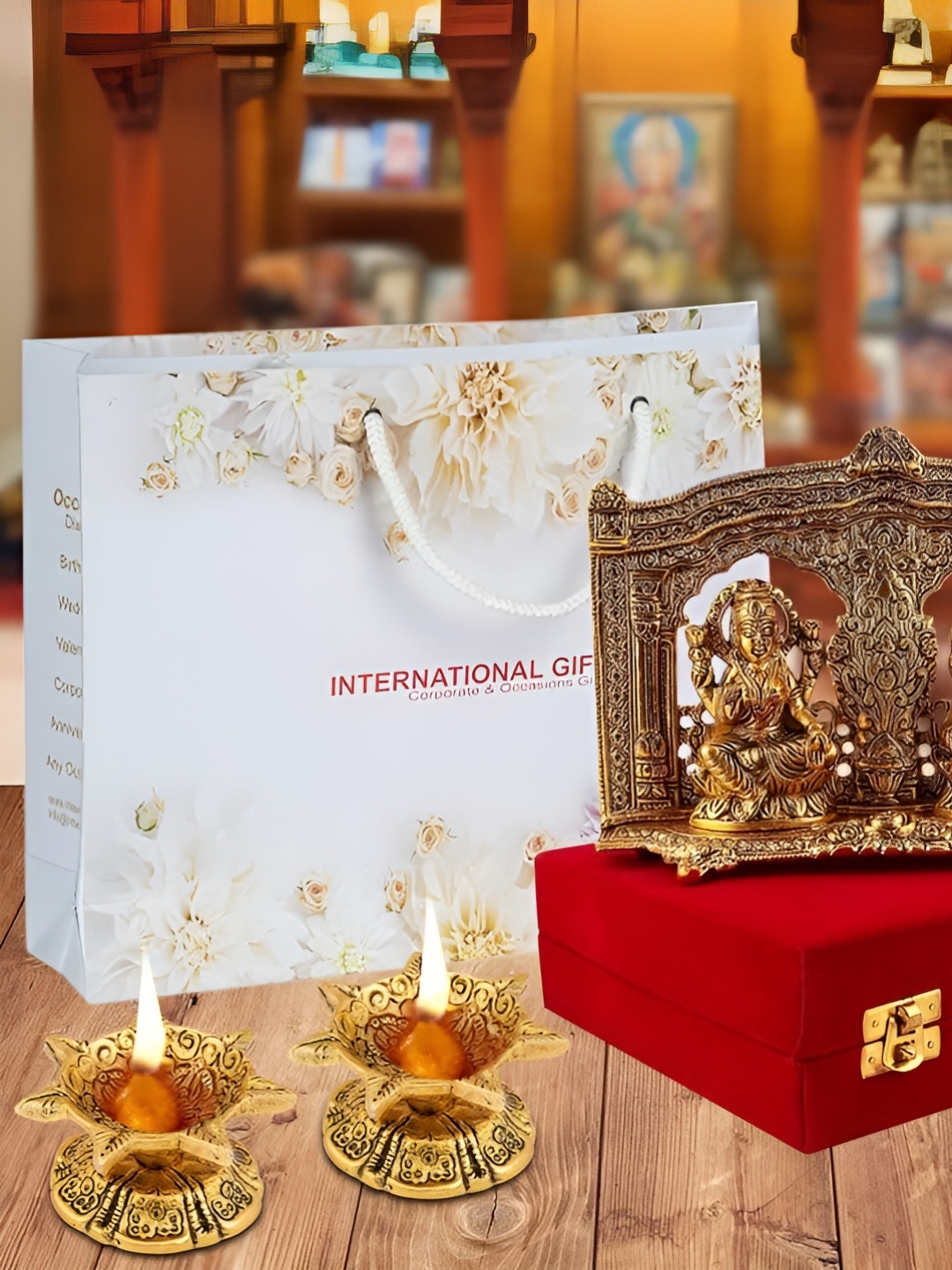 

INTERNATIONAL GIFT Gold-Toned 4 Pieces Religious Idol Showpiece With Diyas & Box