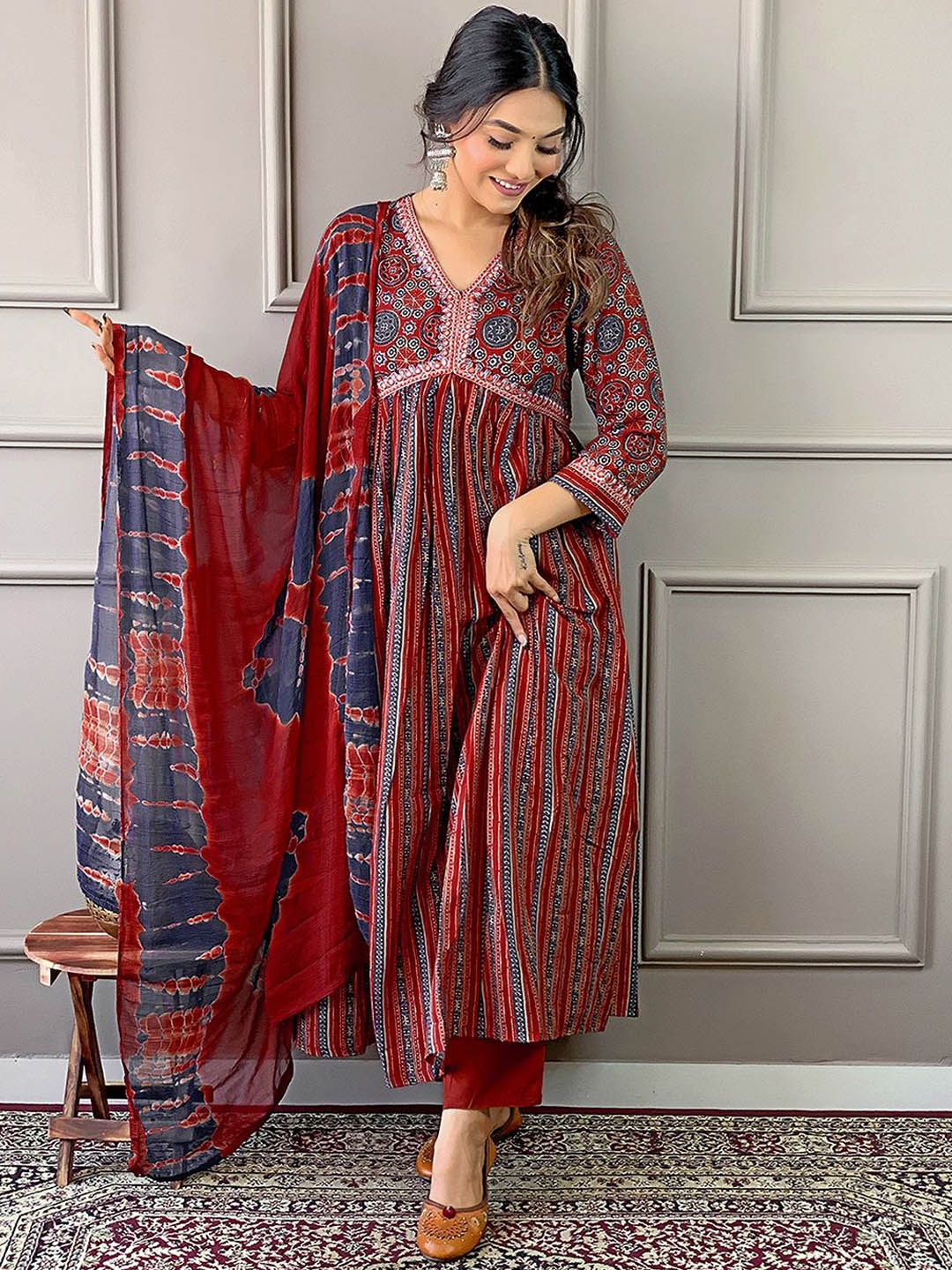 

Ishin Floral Printed Pleated Thread Work Kurta with Trousers & Dupatta, Maroon