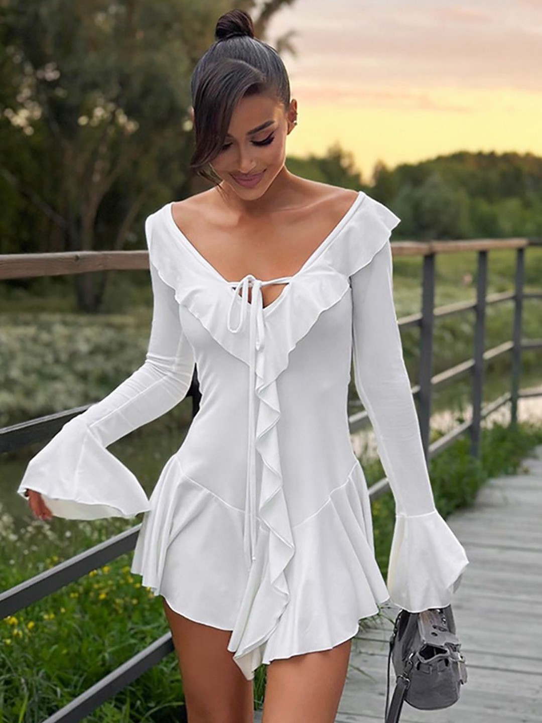 

StyleCast x Revolte Bell Sleeve Ruffled Drop-Waist Mini Dress, White