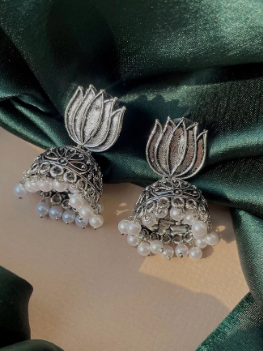 

SUBHAGALANKAR German Silver Plated Oxidised Lotus Shaped Drop Earrings