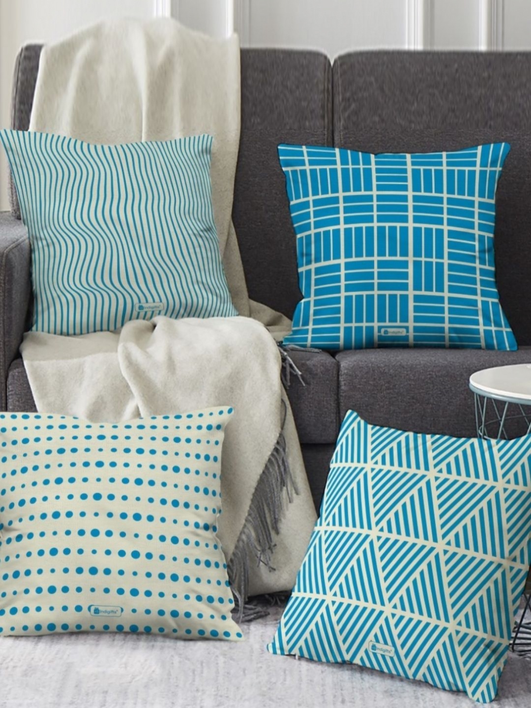 

Indigifts Blue & Off White 4 Pieces Geometric Printed Satin Square Cushion Covers