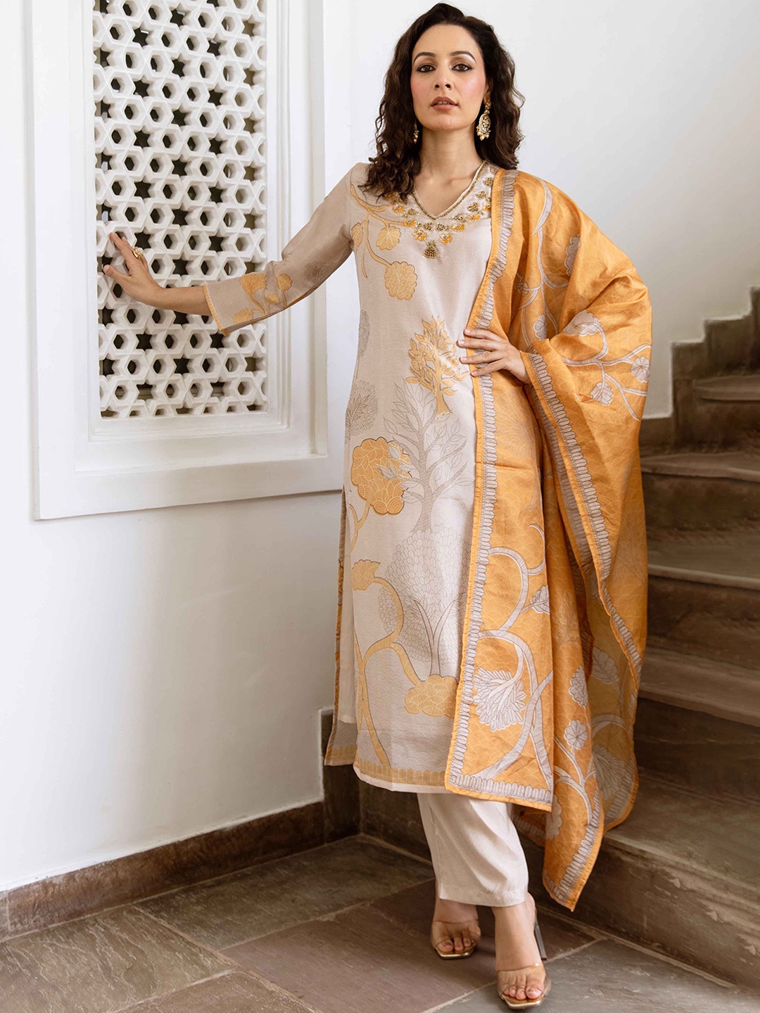 

Nehamta Women Floral Printed Regular Beads and Stones Kurta with Trousers & Dupatta, Cream