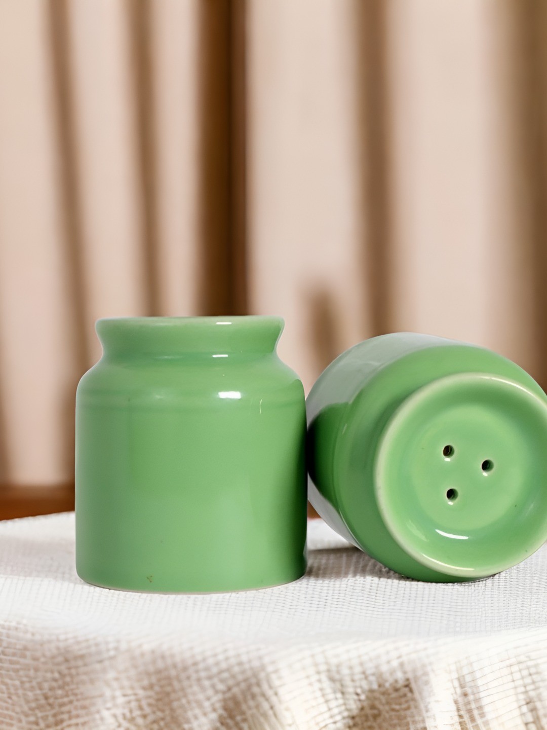 

The Decor Lane Green Ceramic Salt and Pepper Shakers