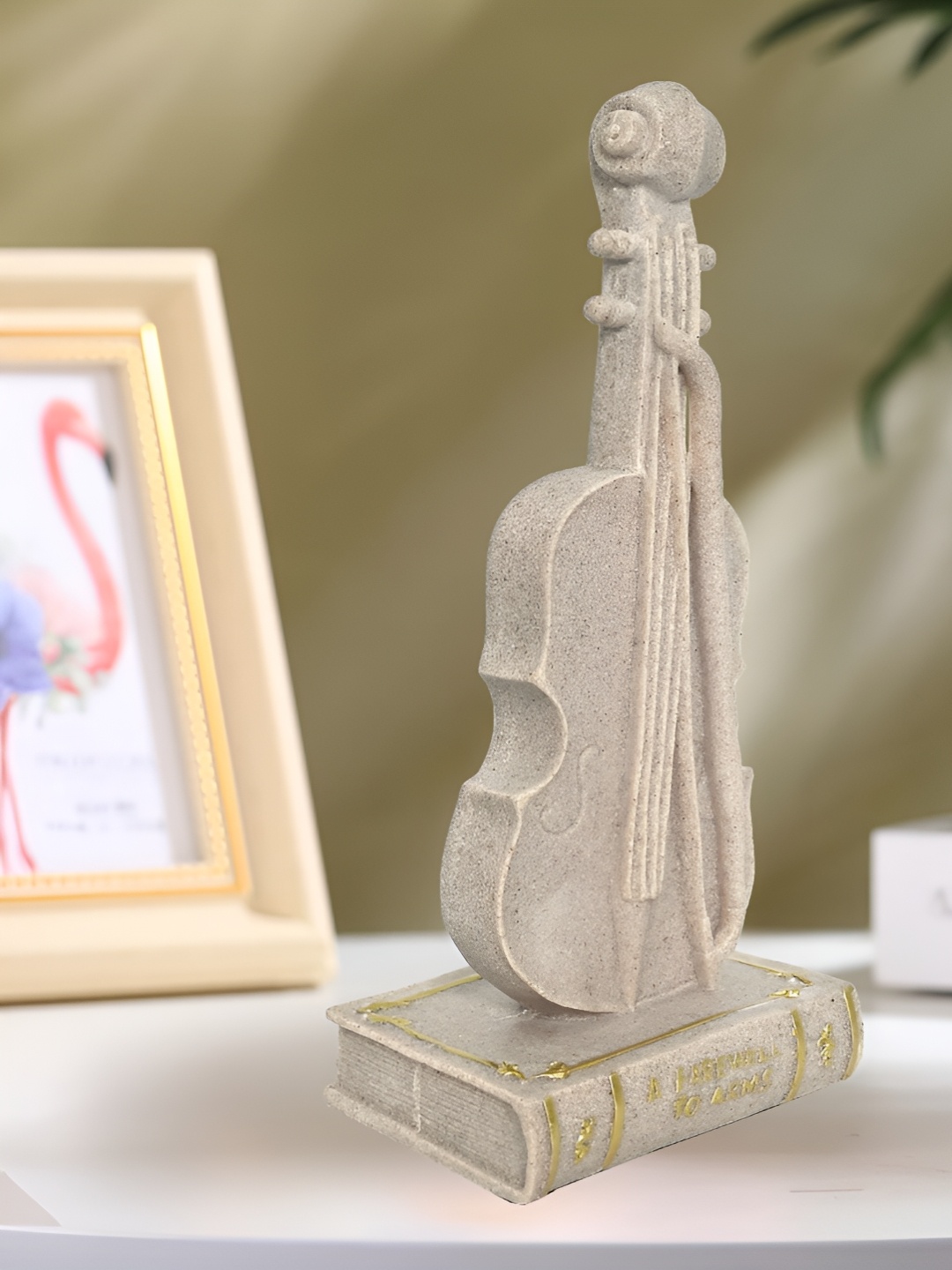 

Cortina Resin Gitar Statue Showpiece, Cream