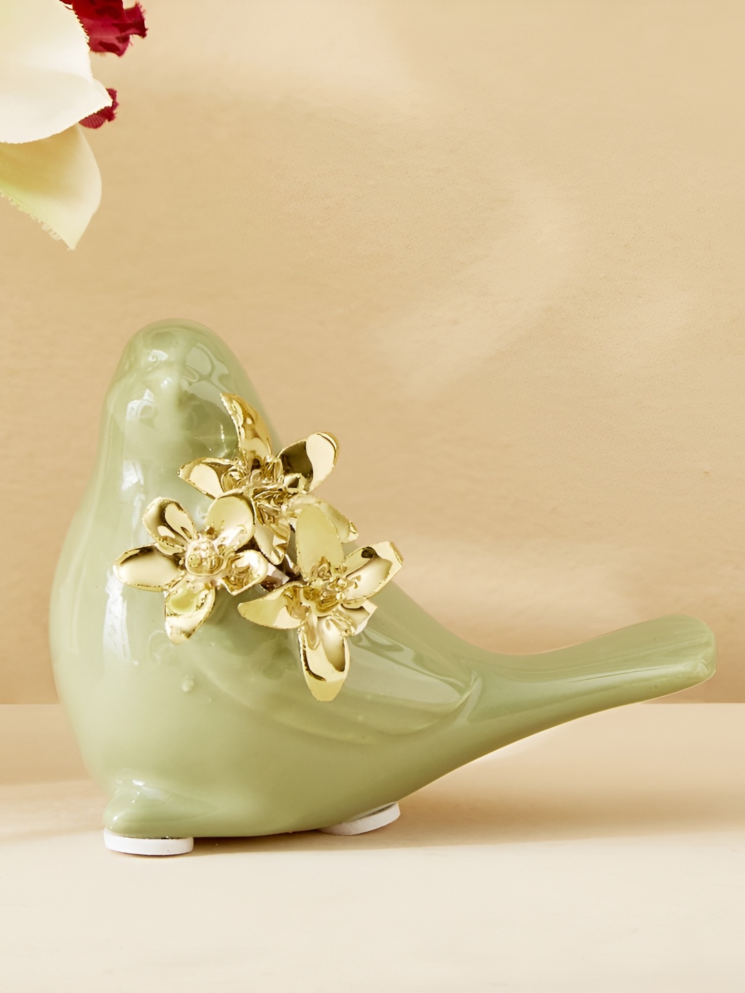 

Home Centre Green Figurine Showpiece