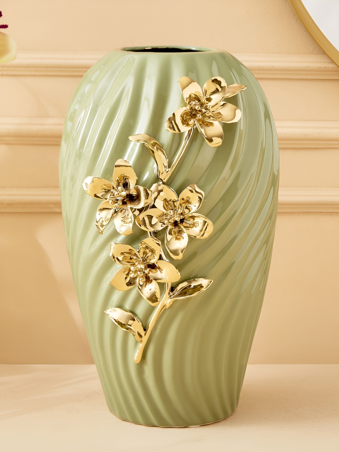 

Home Centre Moksha Green Floral Ribbed Ceramic Floral Vase