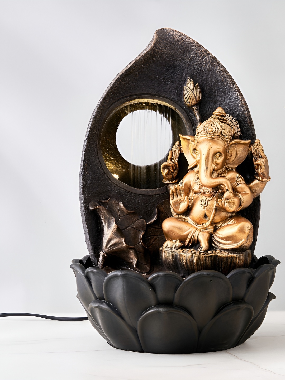 

Home Centre Corsica Alpine Gold-Toned & Black Ganesha Fountain