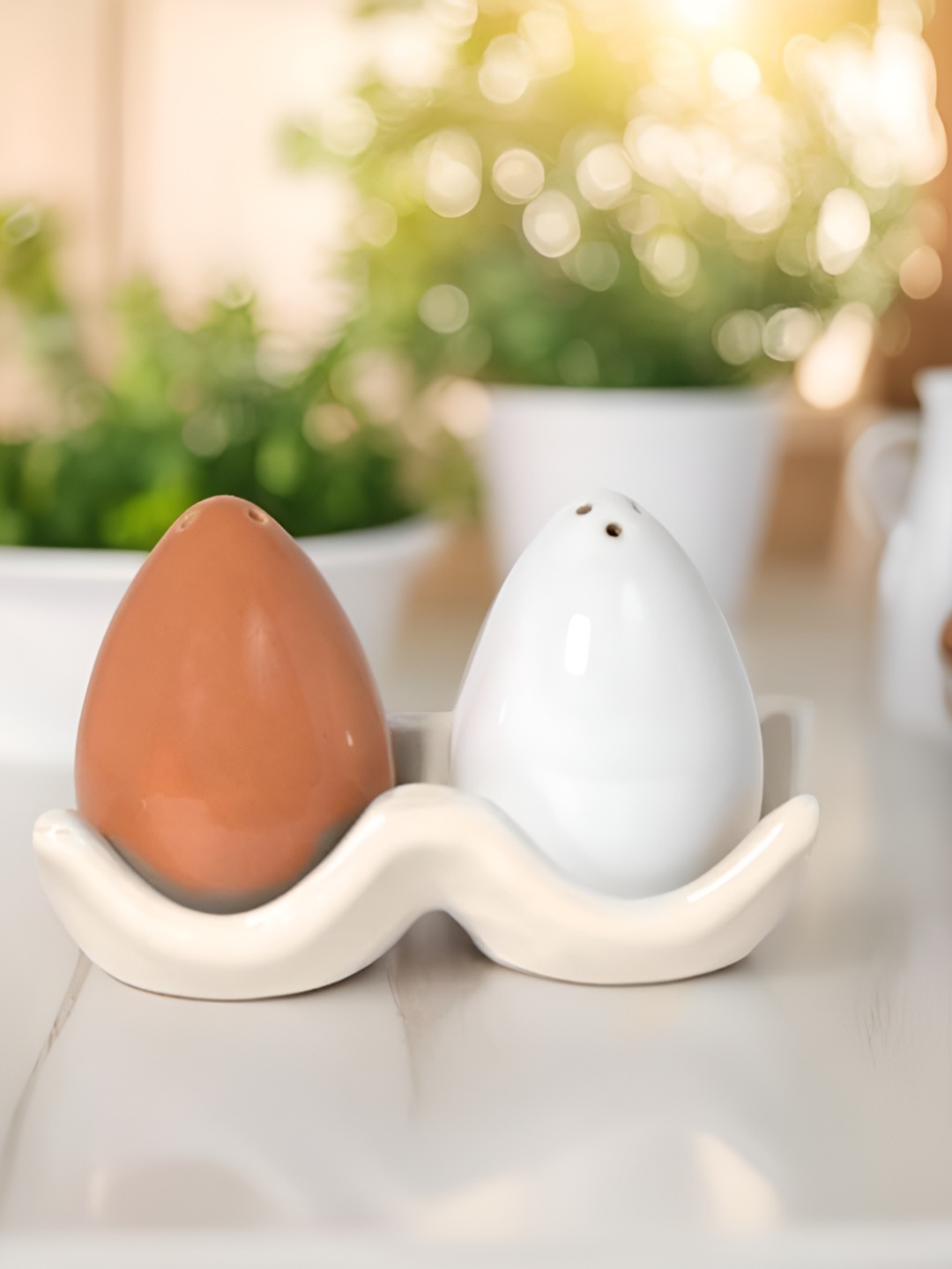 

The Decor Lane White and Beige Ceramic Salt and Pepper Shakers