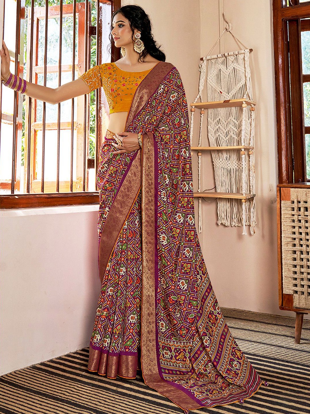 

Mitera Ethnic Motifs Printed Zari Patola Saree, Magenta