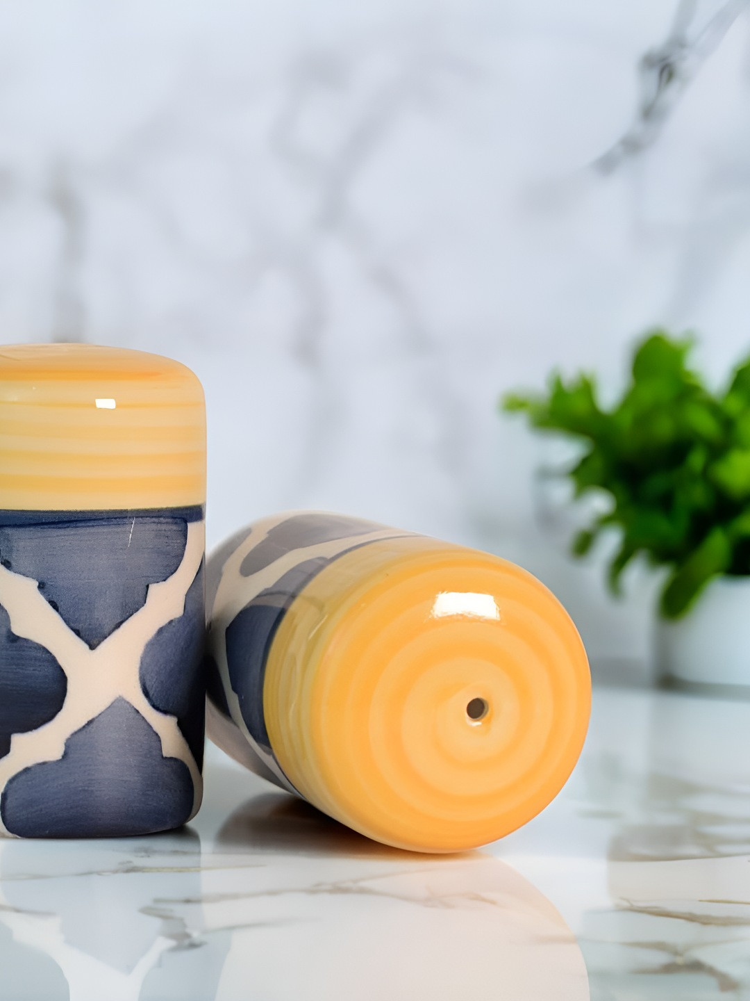 

The Decor Lane Grey and Yellow Ceramic Salt and Pepper Shakers