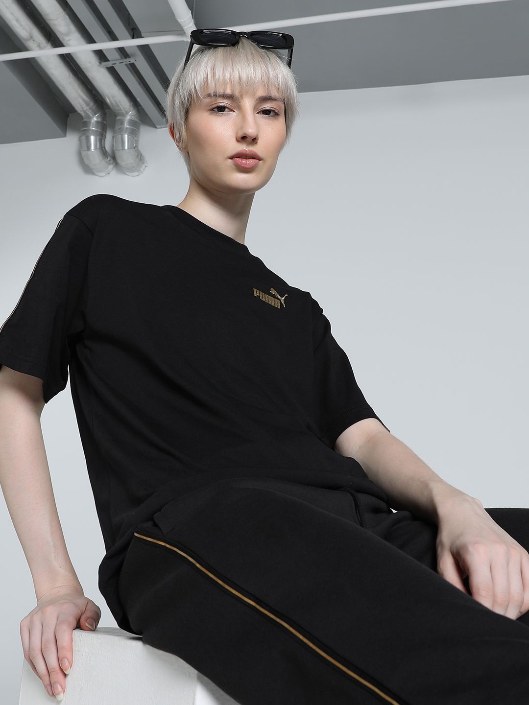 

Puma TAPE MINIMAL GOLD Women Solid Cotton Relaxed Fit T-Shirt, Black