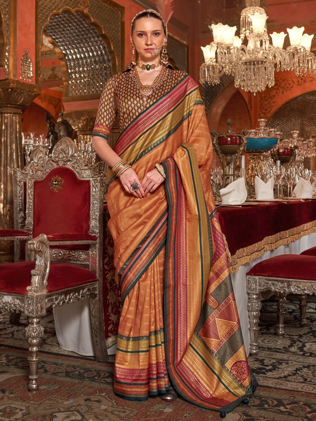 

Anouk Ethnic Motifs Printed Zari Banarasi Saree, Orange