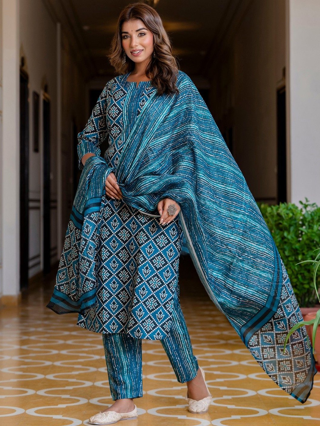 

KALINI Women Floral Printed Regular Kurta with Trousers & Dupatta, Teal