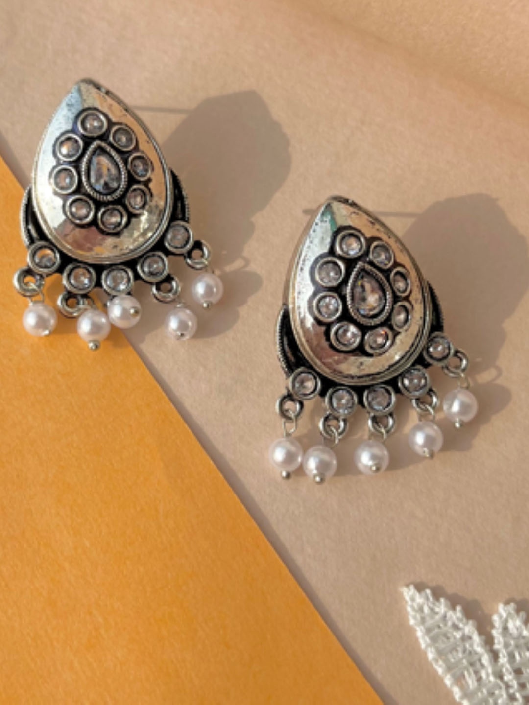 

SUBHAGALANKAR German Silver Plated Oxidised Stone Studded & Beaded Drop Earrings