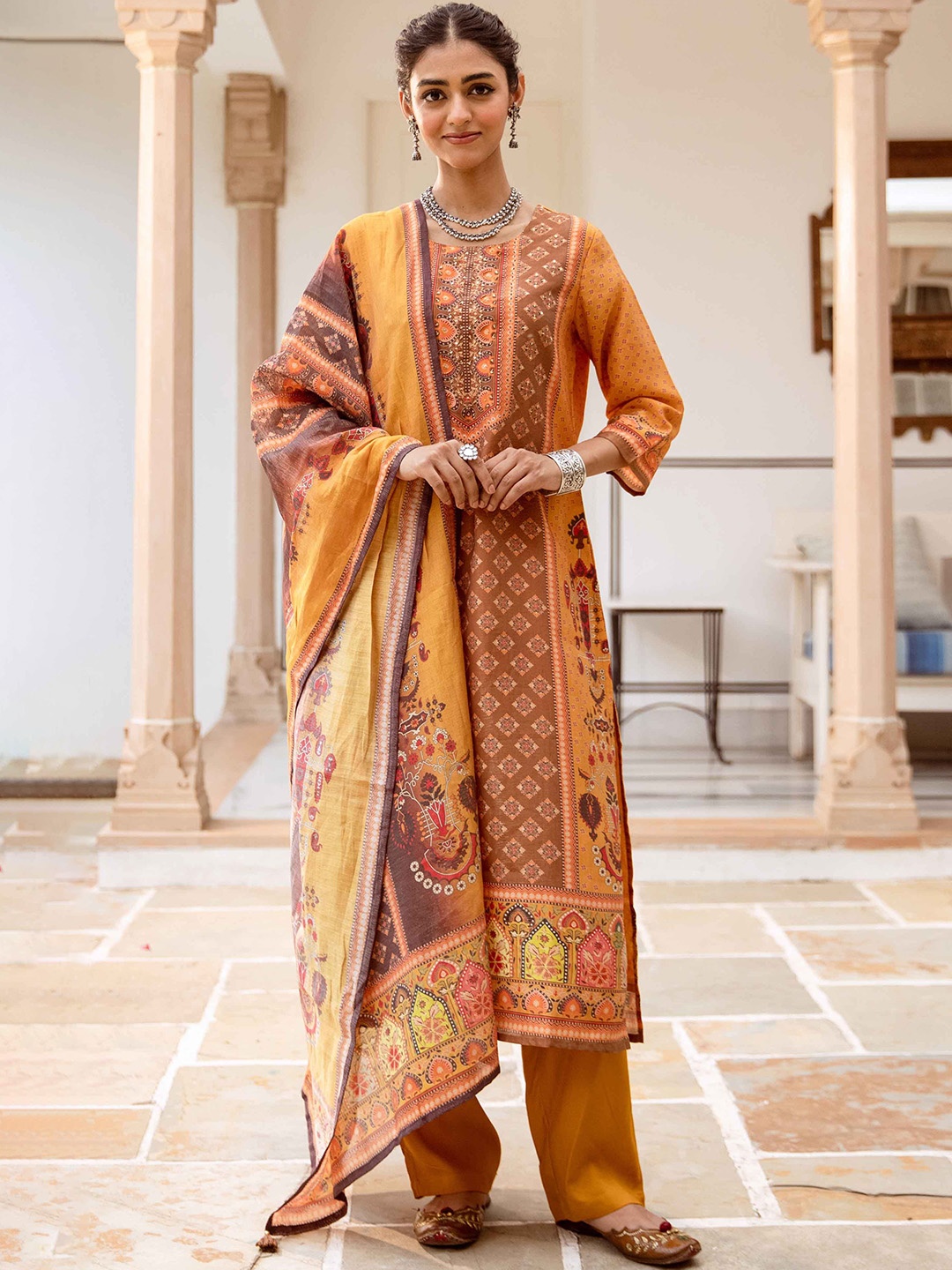 

Nehamta Women Floral Printed Regular Beads and Stones Kurta with Trousers & Dupatta, Mustard