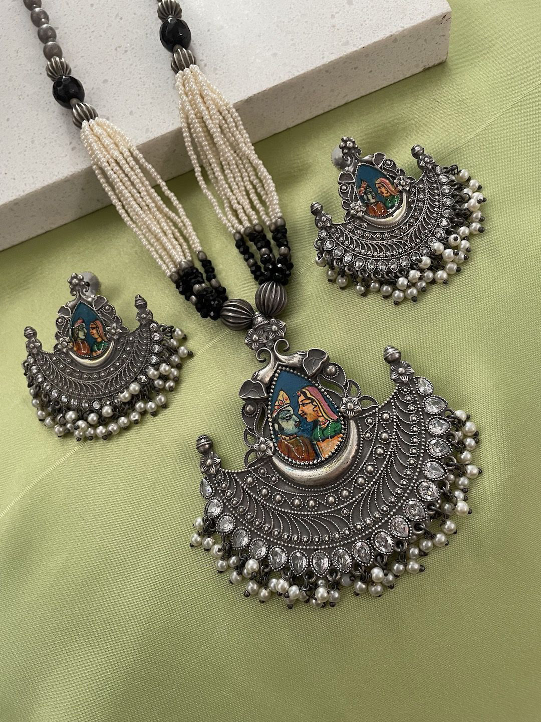 

Digital Dress Room Silver Plated Stone & Beaded Studded Radha Krishna Necklace & Earrings
