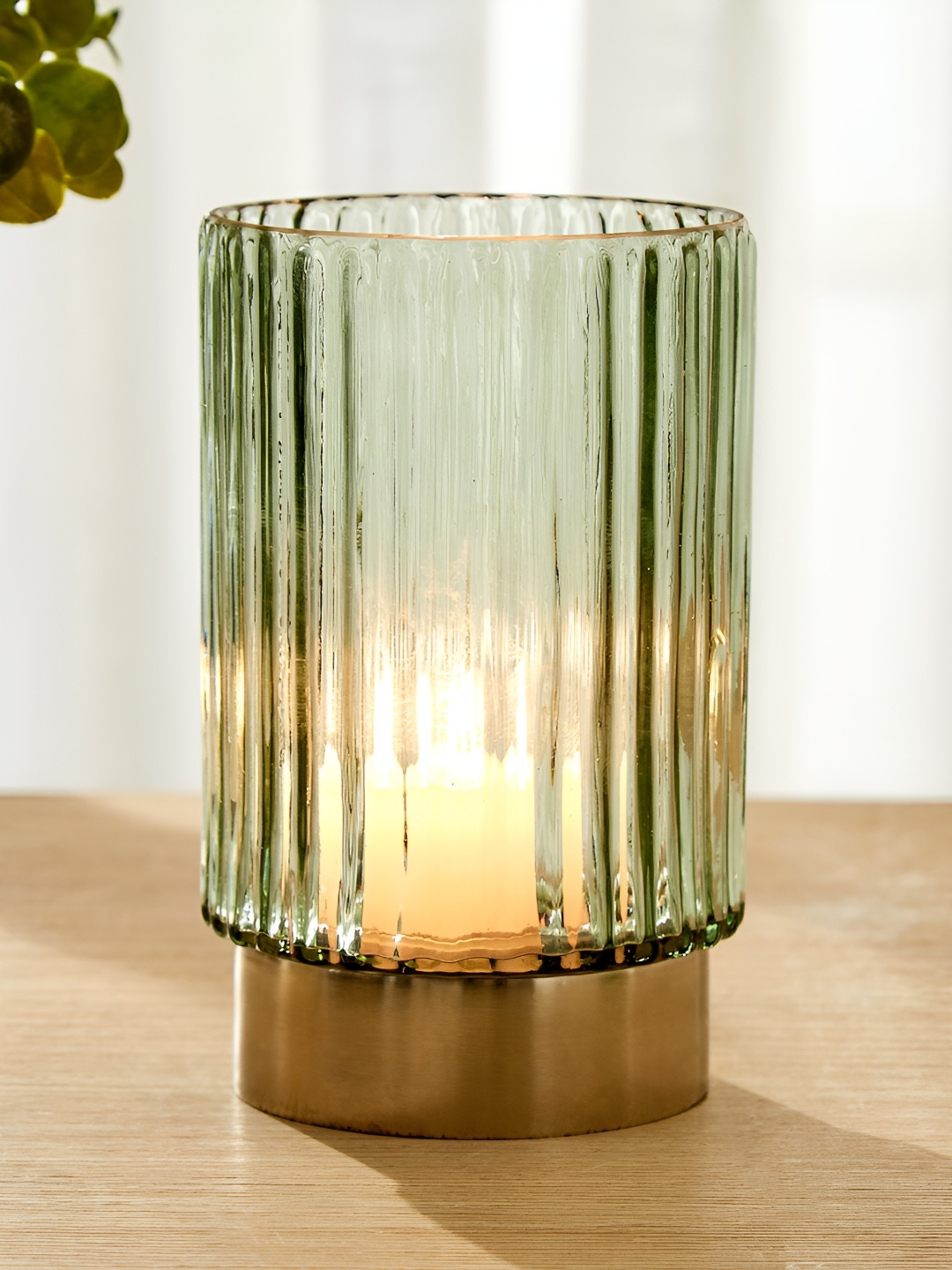 

Home Centre Green Candle Holder