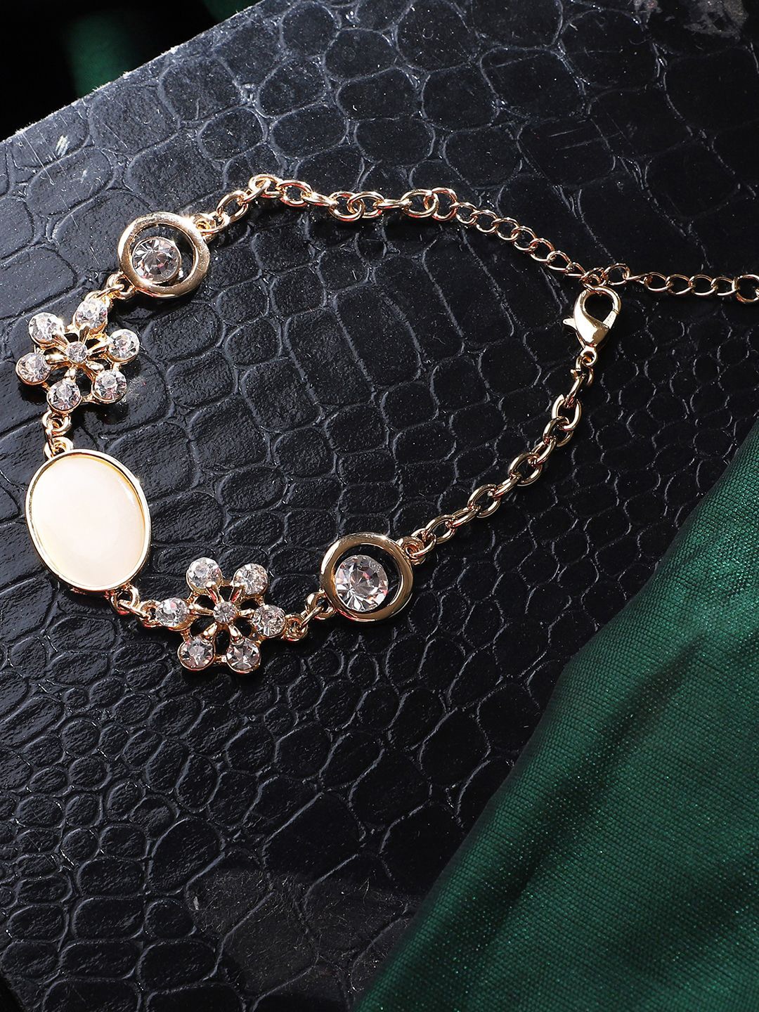 

ANIKAS CREATION Gold-Plated Stone Studded Floral Shaped Link Bracelet