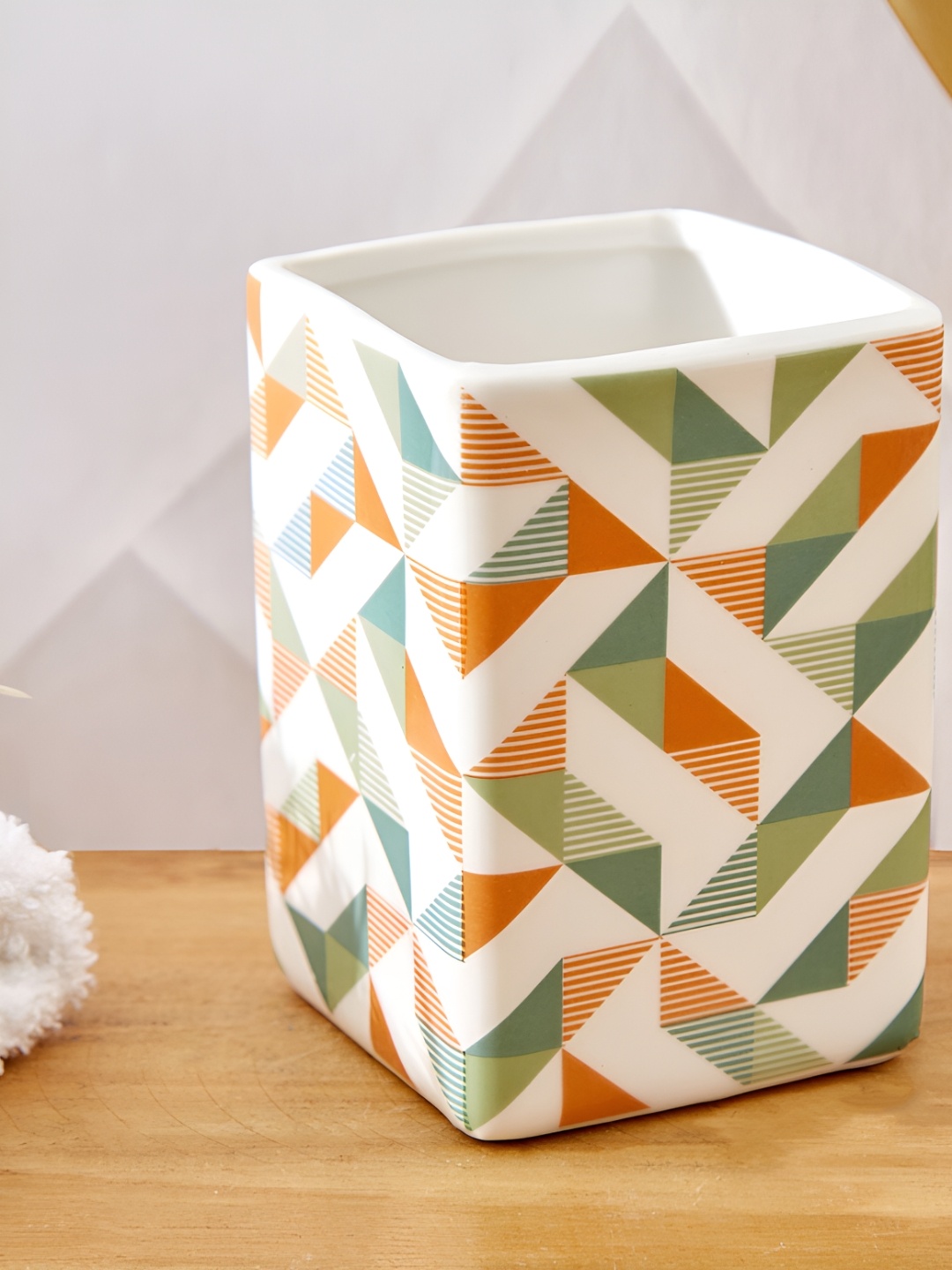 

Home Centre Mekong Apex White & Orange Geometric Ceramic Toothbrush Holder