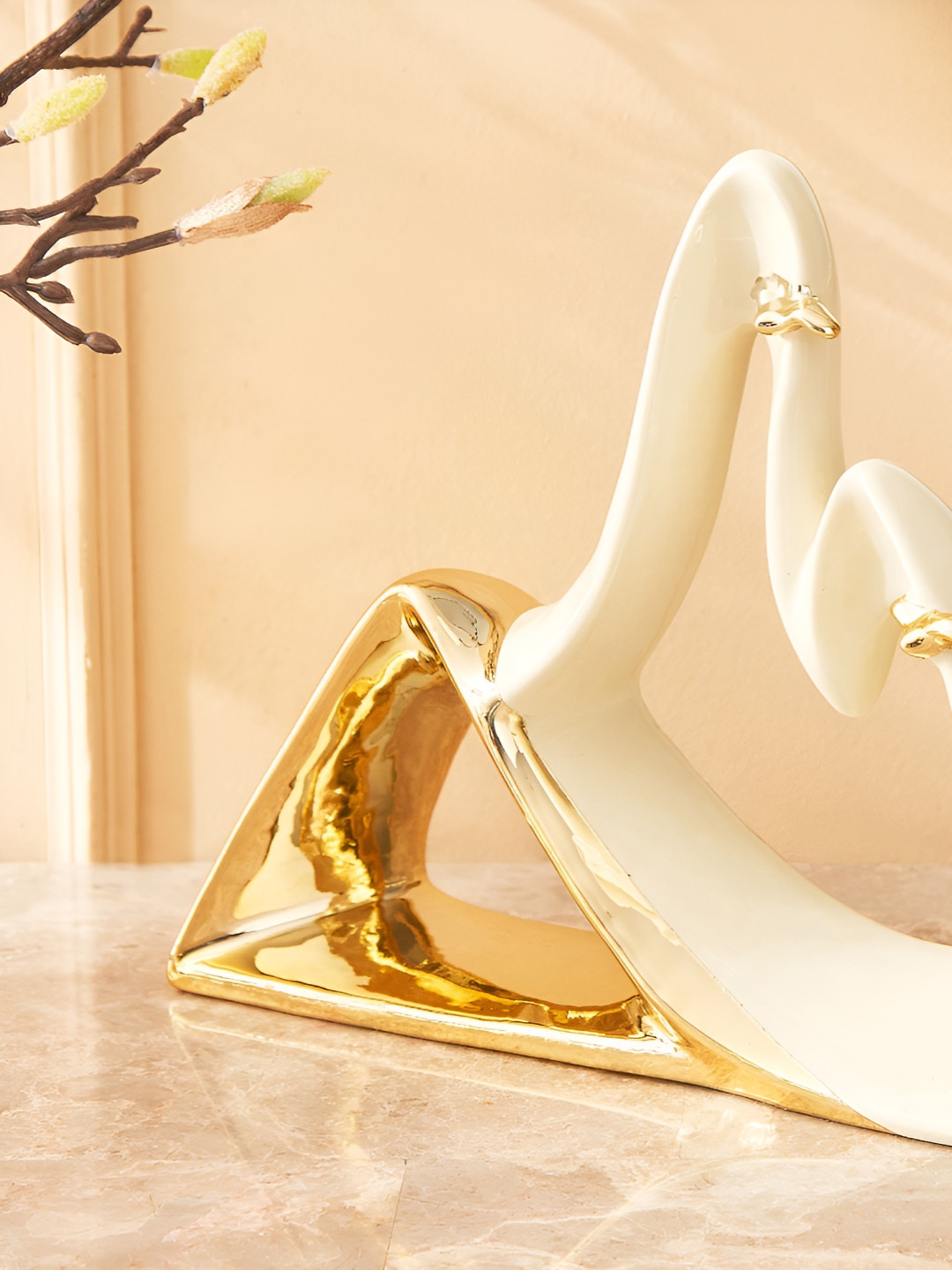 

Home Centre White Figurine Showpiece