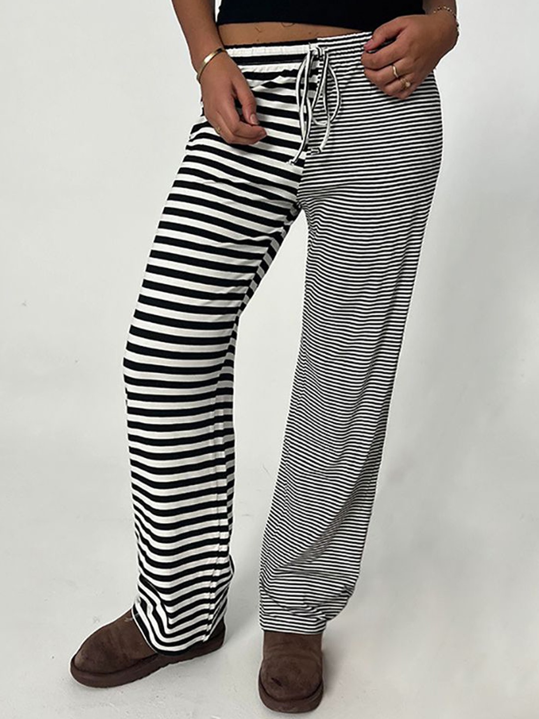 

StyleCast x Revolte Women Striped Loose Fit Regular Trousers, Black