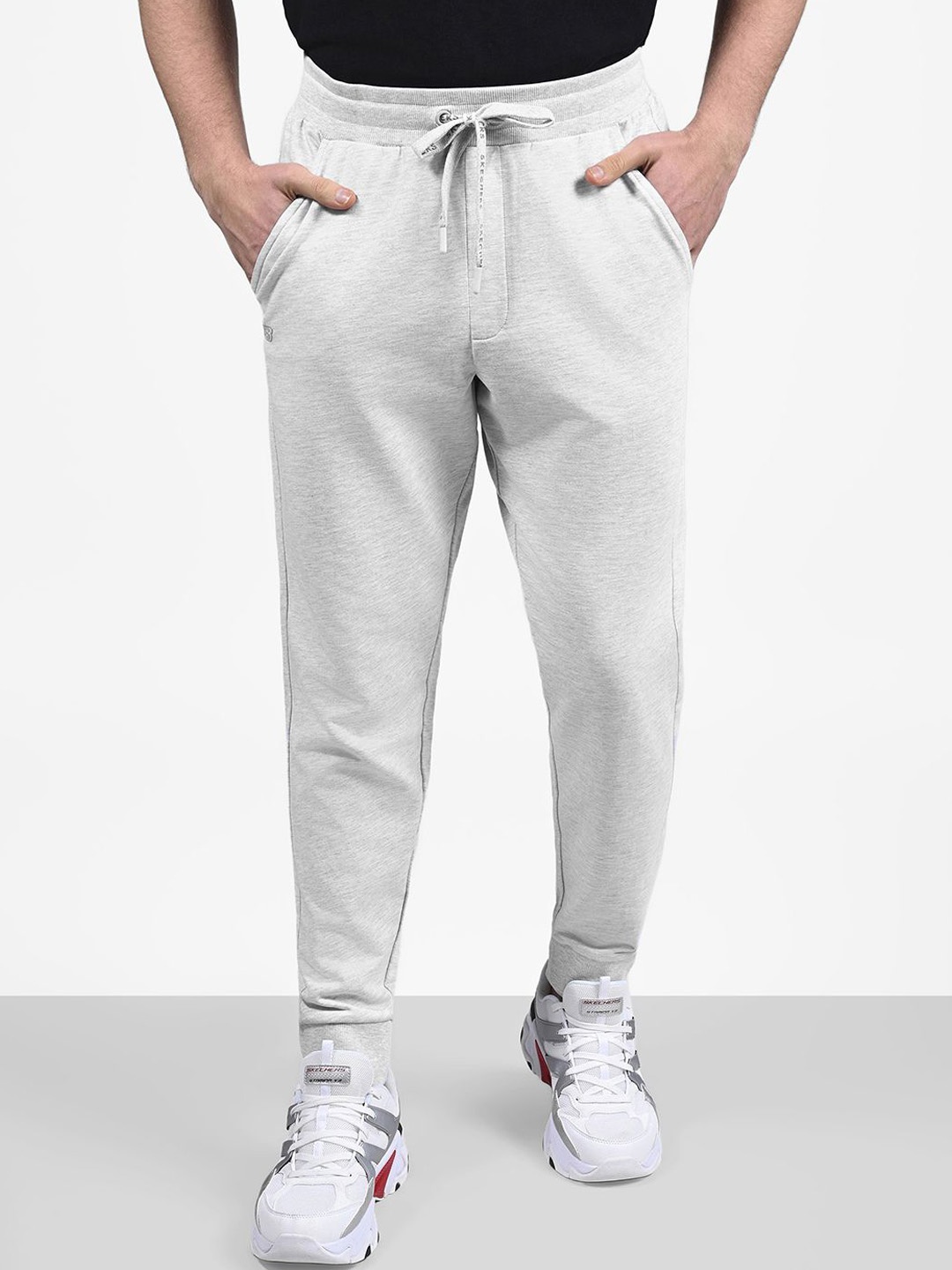 

Skechers EARTH PEACE Men Mid Rise Comfort Fit Solid Cotton Joggers, Off white
