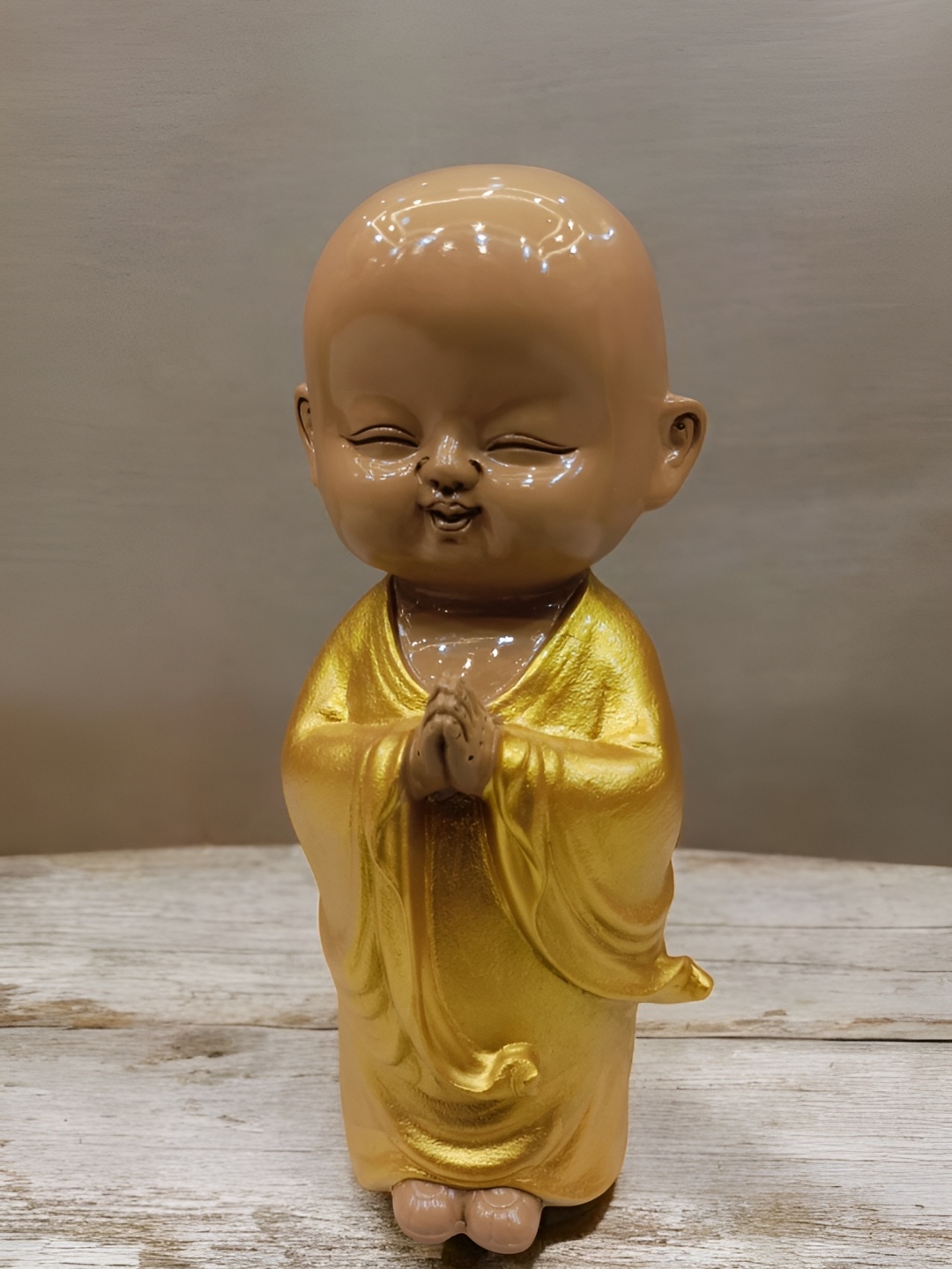 

SANKALAN CREATIONS Gold-Toned & Brown Baby Monk Figurine Showpiece