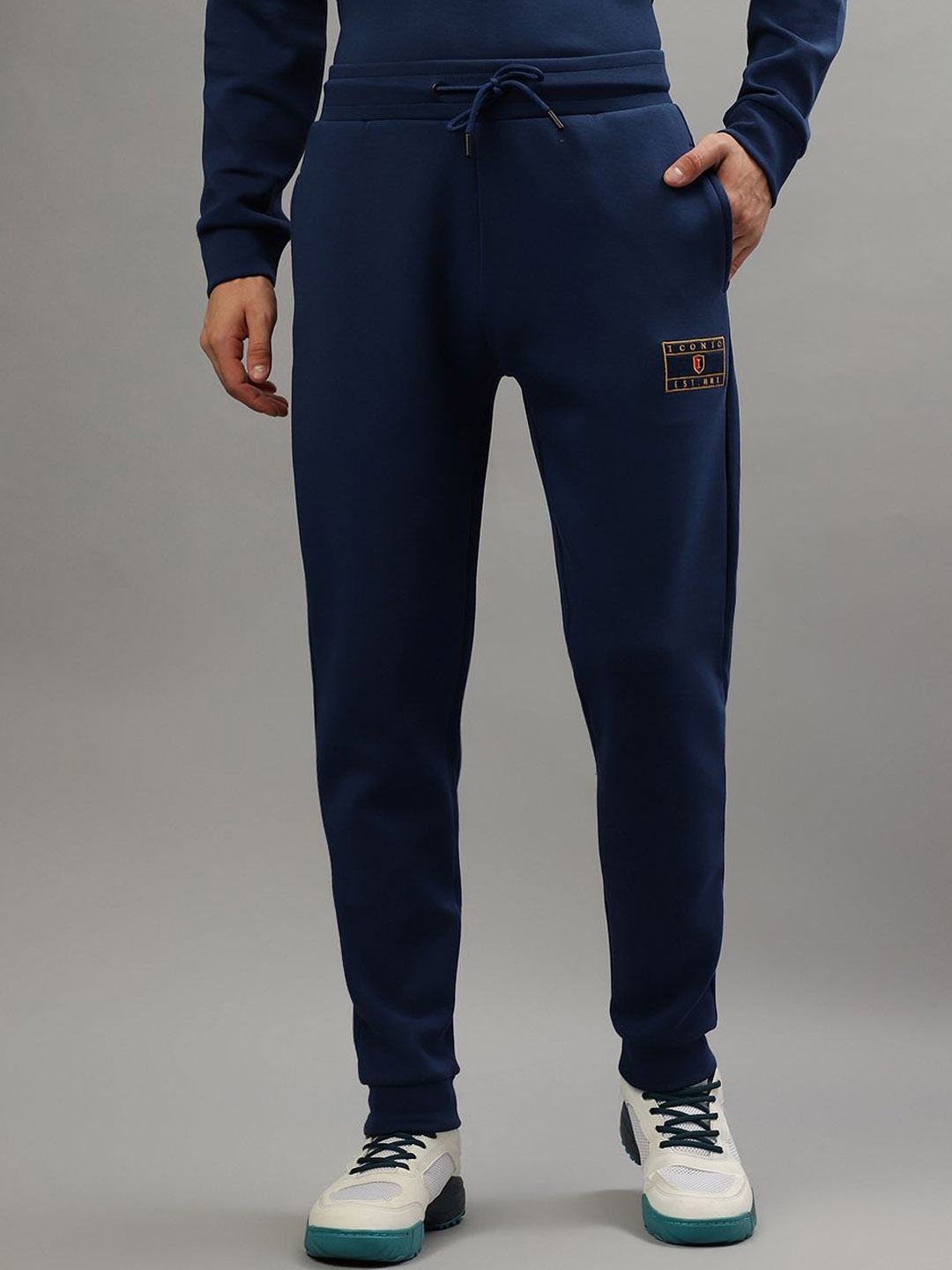 

Iconic Men Solid Regular Fit Mid-Rise Joggers, Blue