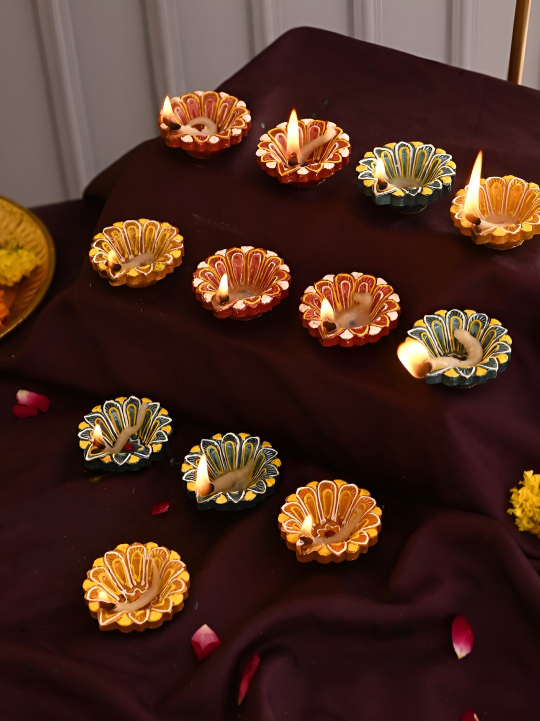 

Aura 12 Pcs Green & Yellow 12 Pieces Printed Terracotta Wax Diyas
