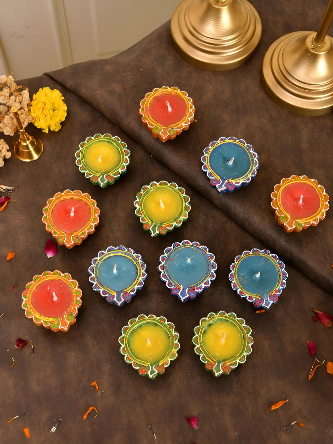 

Aapno Rajasthan Blue & Yellow 12 Pieces Printed Leaf Wax Diyas