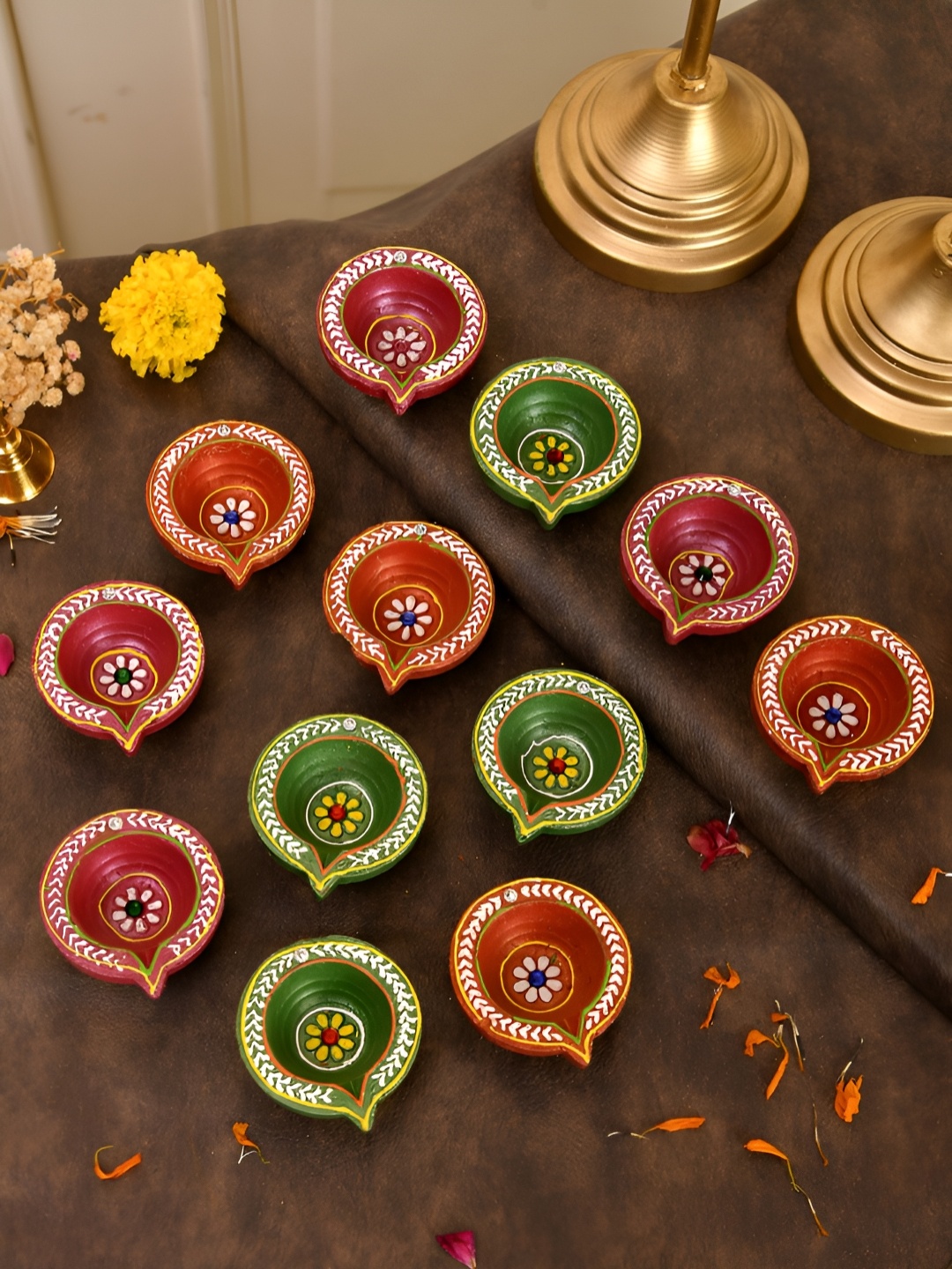 

Aapno Rajasthan Orange-Coloured & Green 12 Pieces Floral Printed Terracotta Diwali Diyas