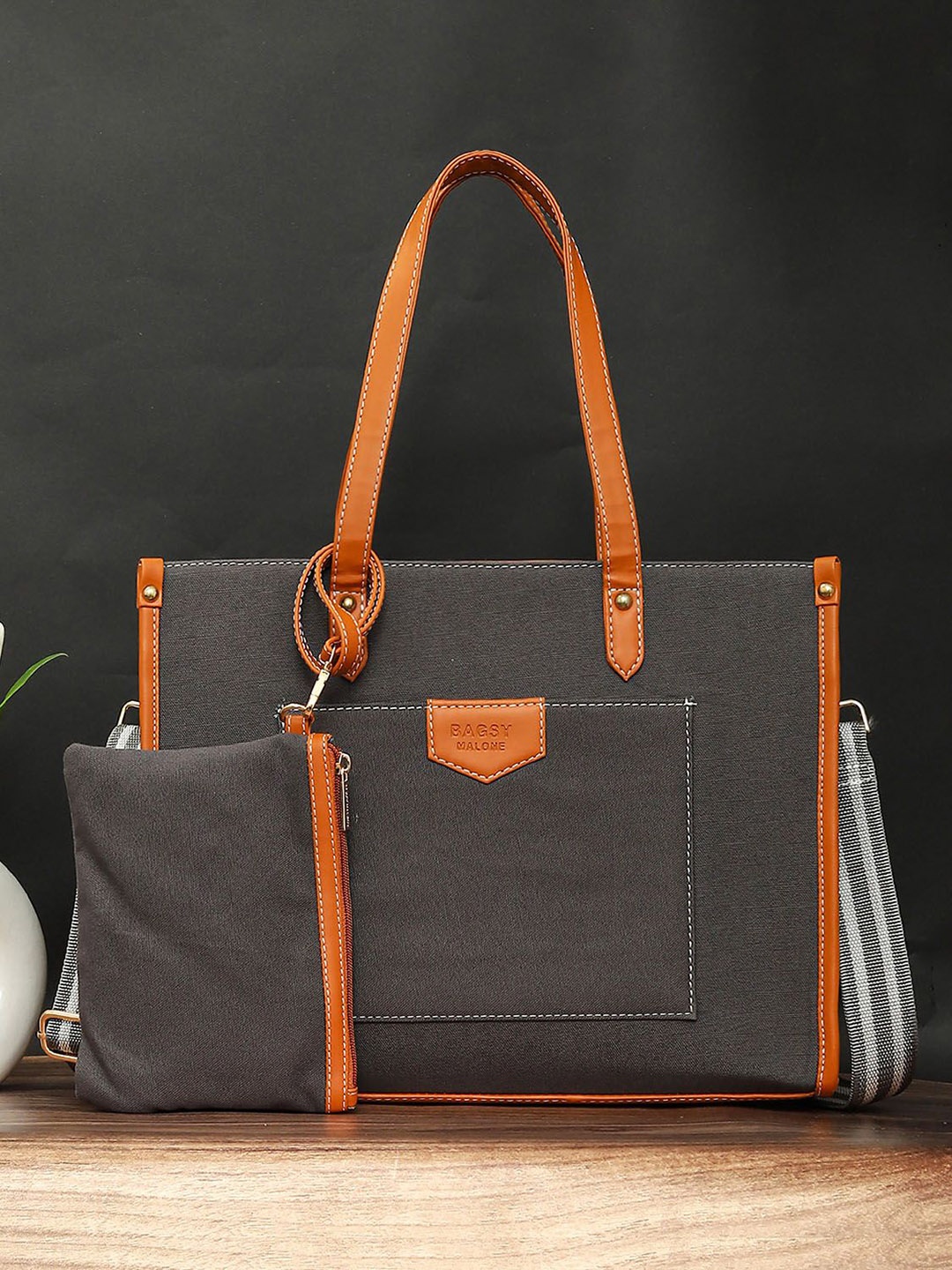 

Bagsy Malone Women Solid Structured Shoulder Up To 16 Inch Bag, Grey