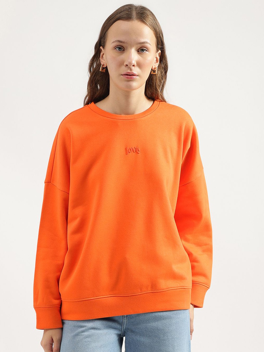 

United Colors of Benetton Women Solid Round Neck Cotton Pullover Sweatshirt, Orange