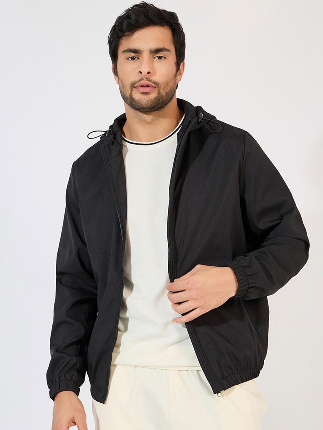 

Styli Men Solid Hooded Elasticated Hem Detail Windbreaker Biker Jacket, Black