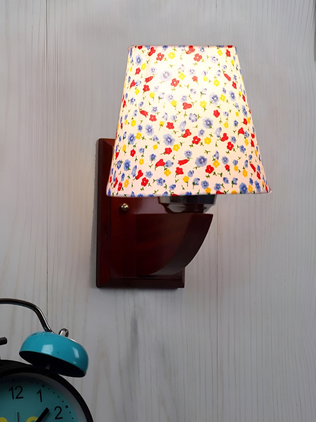 

Devansh White & Blue Floral Printed Frustum Shaped Wooden Wall Lamp