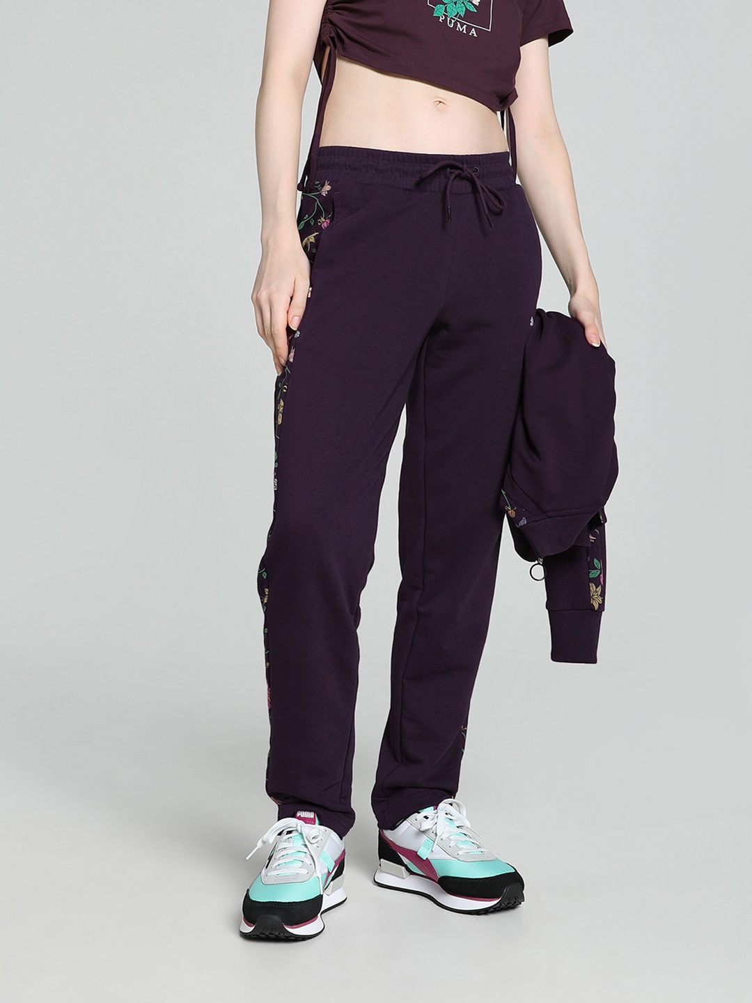 

Puma Women CLASSICS PETALIA T7 Women Floral With Brand Logo Printed Cotton Track Pants, Purple