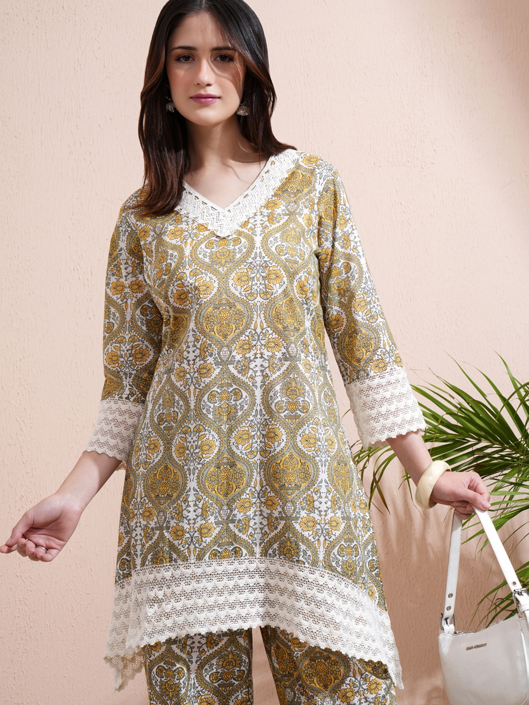 

Vishudh Cream Printed V-Neck Three-Quarter Sleeves Pure Cotton Top With Trouser