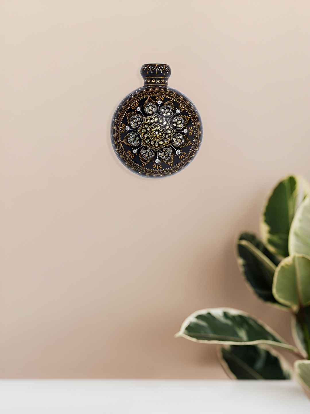 

Golden Peacock Black & Gold Toned Meenakari Printed Matka Shaped Hanging Wall Decor