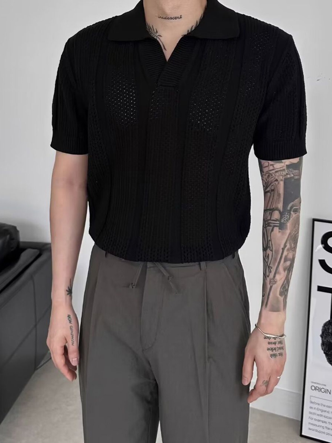 

StyleCast x Revolte Men Self Design Polo Collar T-shirt, Black