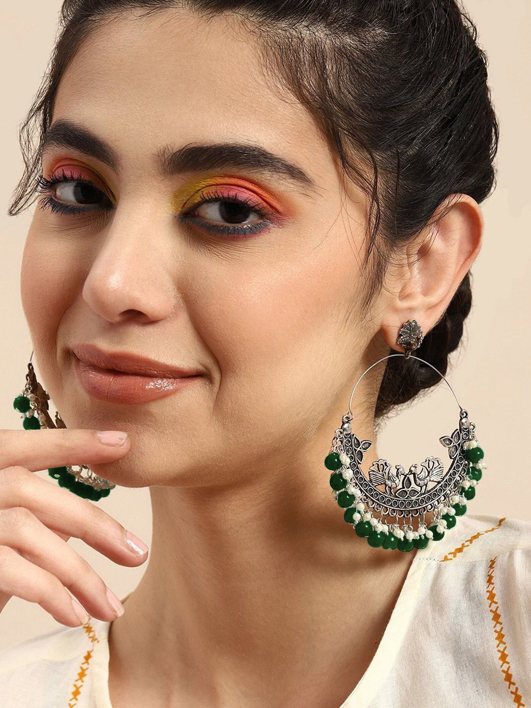 

VAGHBHATT Silver-Plated Oxidized Peacock Shaped Pearls Beaded Chandbalis