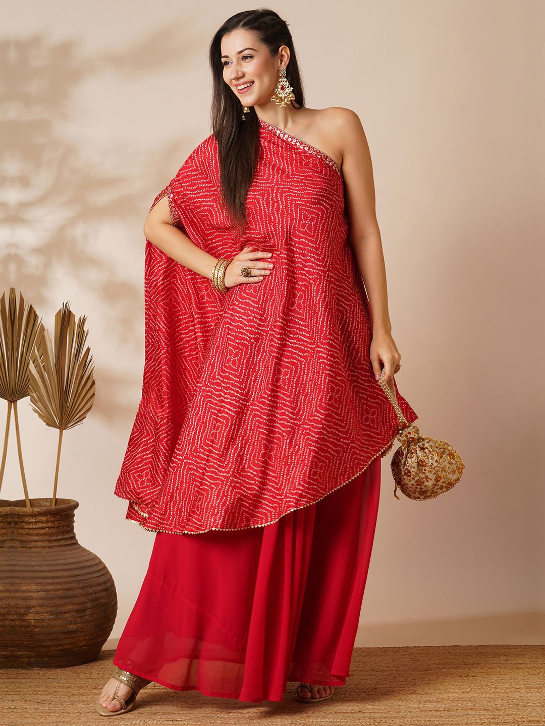 

Globus Red Bandhani Printed One Shoulder Tunic & Georgette Skirt