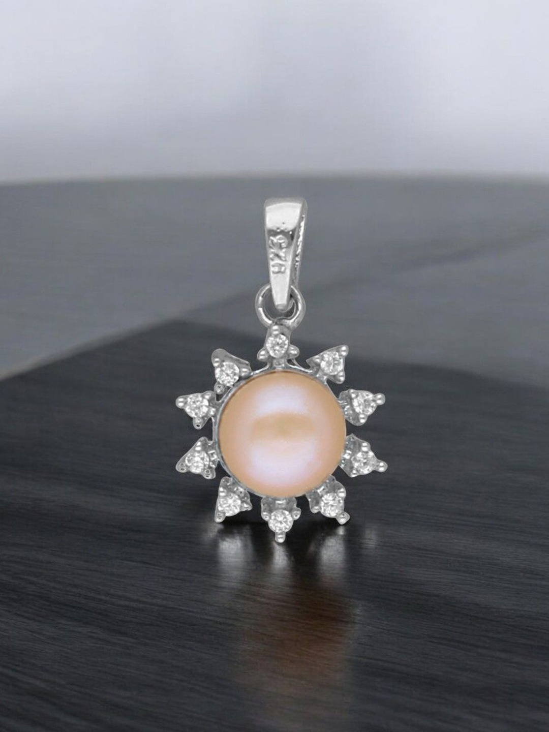 

Sri Jagdamba Pearls Dealer Silver Plated 92.5 Sterling Silver Circular Pendant