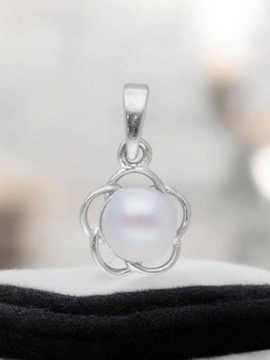 

Sri Jagdamba Pearls Dealer 92.5 Sterling Silver Floral Shaped Pendants